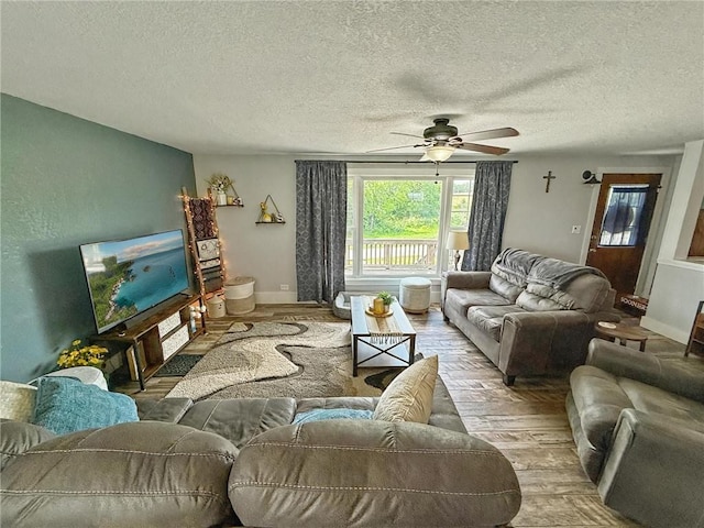 26240 Lakeview Dr, Maryville, MO 64468 - living area featuring hardwood / wood-style flooring, a ceiling fan, and a textured ceiling