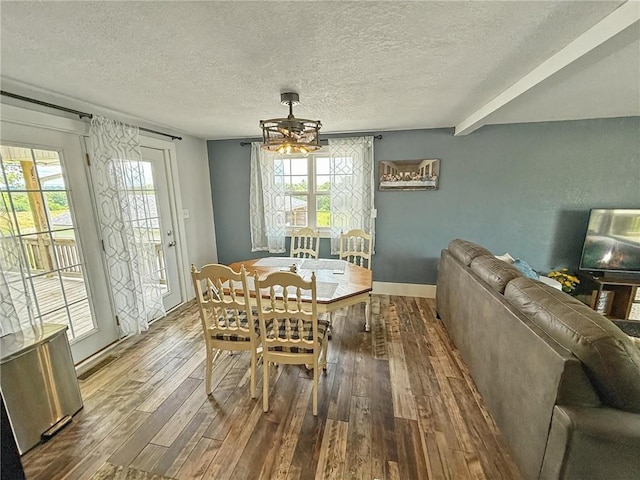 26240 Lakeview Dr, Maryville, MO 64468 - dining room with wood finished floors, a textured ceiling, and a ceiling fan