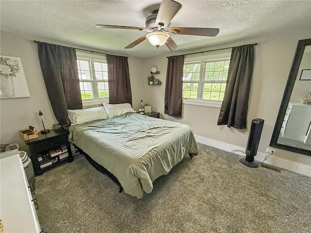 26240 Lakeview Dr, Maryville, MO 64468 - carpeted bedroom featuring a textured ceiling, multiple windows, and ceiling fan