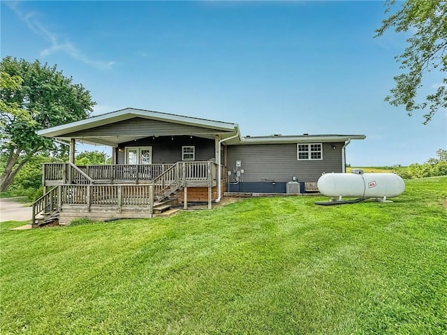 26240 Lakeview Dr, Maryville, MO 64468 - back of house with a lawn and covered porch