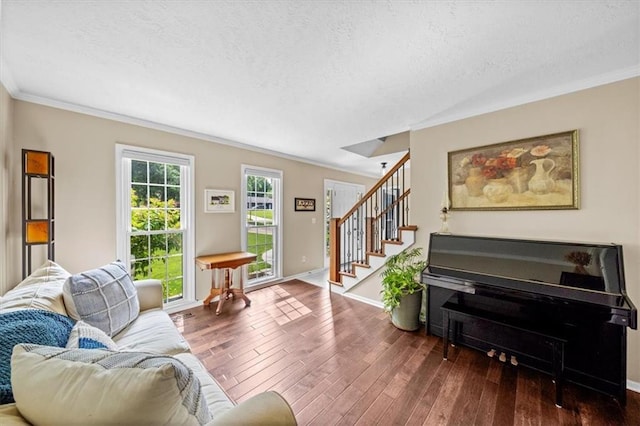 6710 Broadmoor St, Overland Park, KS 66204 - living area featuring a textured ceiling, ornamental molding, wood finished floors, and stairs