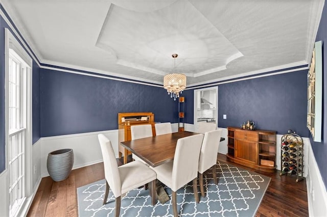 6710 Broadmoor St, Overland Park, KS 66204 - dining space with a raised ceiling, wood-type flooring, and a chandelier