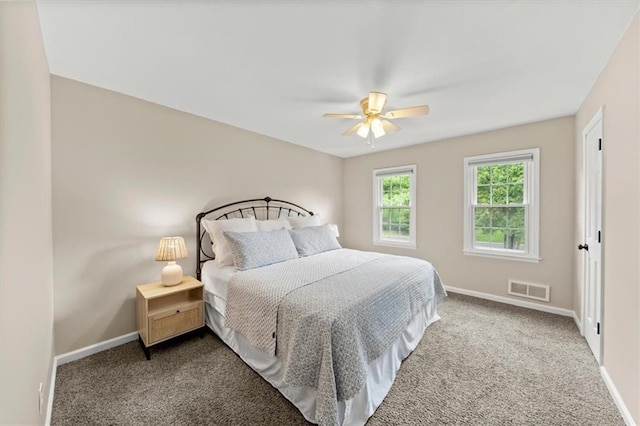 6710 Broadmoor St, Overland Park, KS 66204 - carpeted bedroom with baseboards and a ceiling fan