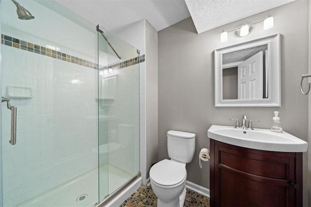 6710 Broadmoor St, Overland Park, KS 66204 - bathroom featuring a textured ceiling, a stall shower, vanity, and tile patterned flooring