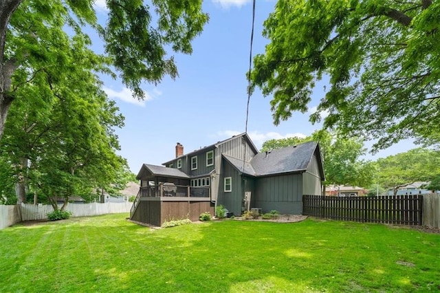 6710 Broadmoor St, Overland Park, KS 66204 - back of house featuring a fenced backyard and a chimney