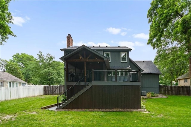 6710 Broadmoor St, Overland Park, KS 66204 - back of house featuring stairway, a fenced backyard, a chimney, and a sunroom