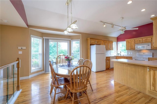 23708 S Southcrest Dr, Peculiar, MO 64078 - dining room with vaulted ceiling, light wood-style flooring, ceiling fan, recessed lighting, and rail lighting