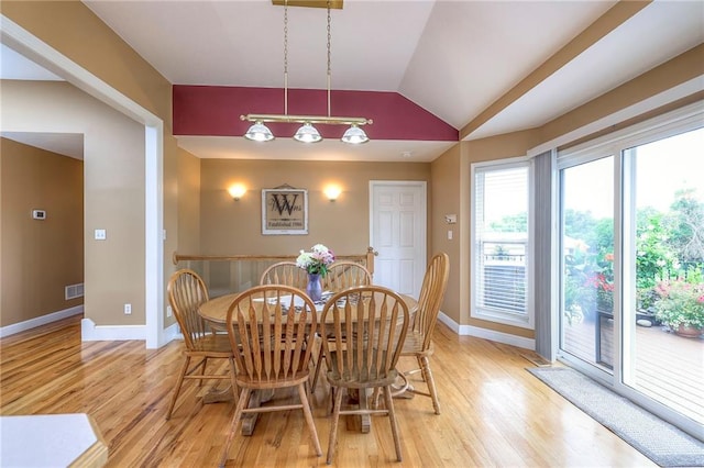 23708 S Southcrest Dr, Peculiar, MO 64078 - dining space featuring light wood-type flooring and vaulted ceiling