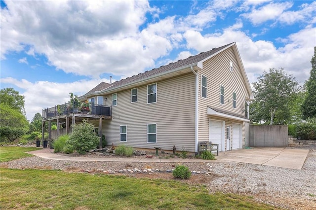 23708 S Southcrest Dr, Peculiar, MO 64078 - view of property exterior featuring an attached garage, concrete driveway, and a deck