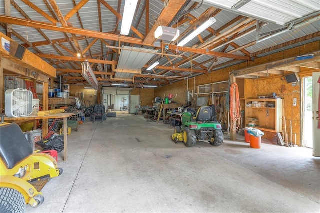 23708 S Southcrest Dr, Peculiar, MO 64078 - garage with a workshop area and a garage door opener