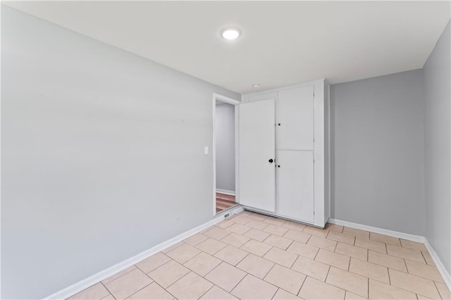 5510 Lafayette Ave, Kansas City, KS 66104 - spare room with baseboards and recessed lighting