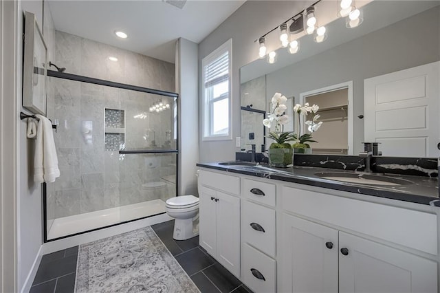 3323 N 109th Ter, Kansas City, KS 66109 - full bathroom featuring double vanity, a stall shower, and tile patterned flooring