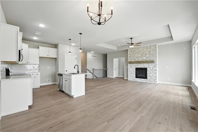 3319 N 109th Ter, Kansas City, KS 66109 - kitchen with a raised ceiling, stainless steel dishwasher, a ceiling fan, range, and recessed lighting