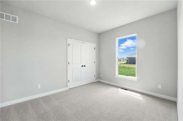 3319 N 109th Ter, Kansas City, KS 66109 - unfurnished bedroom featuring carpet and a closet