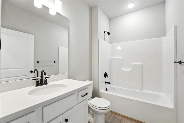 3319 N 109th Ter, Kansas City, KS 66109 - full bathroom with vanity, shower / tub combination, and wood finished floors