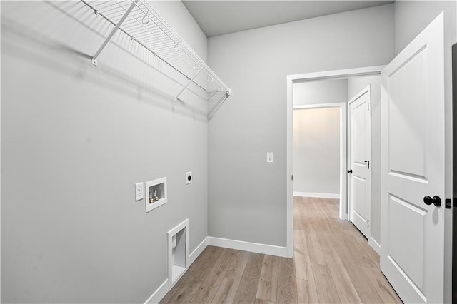 3319 N 109th Ter, Kansas City, KS 66109 - washroom with hookup for an electric dryer, light wood-type flooring, and hookup for a washing machine