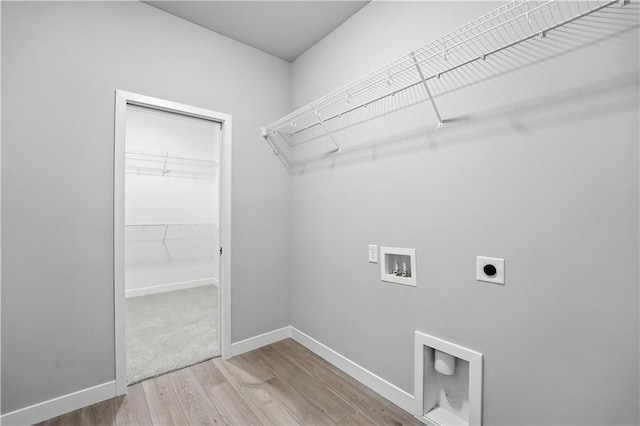 3319 N 109th Ter, Kansas City, KS 66109 - washroom with hookup for an electric dryer, wood finished floors, and hookup for a washing machine