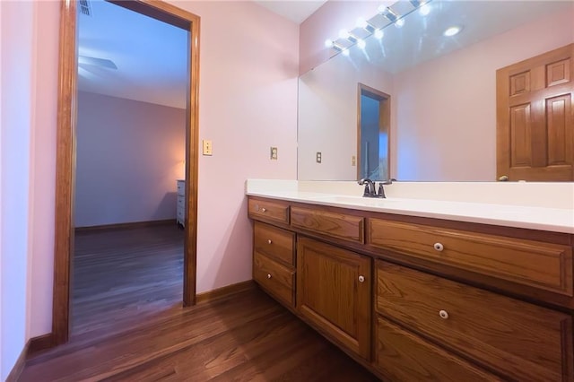 13009 Fontana St, Leawood, KS 66209 - bathroom featuring vanity and wood finished floors