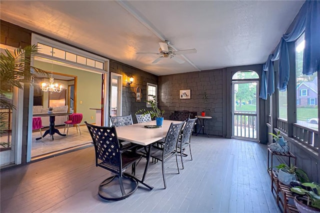 13009 Fontana St, Leawood, KS 66209 - dining room featuring ceiling fan, a chandelier, and hardwood / wood-style flooring