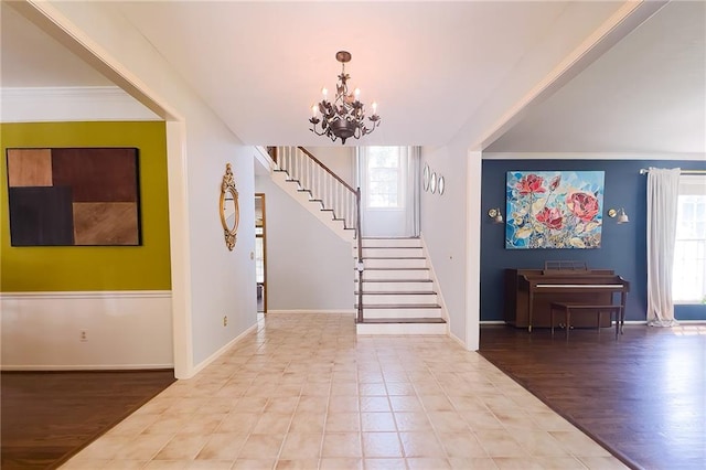 13009 Fontana St, Leawood, KS 66209 - entryway with a chandelier, stairs, and wood finished floors
