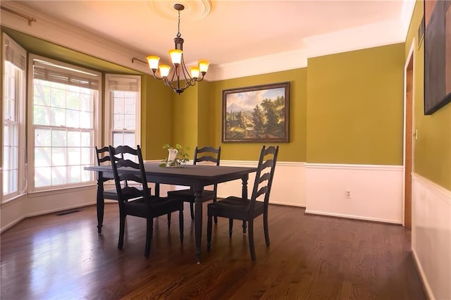 13009 Fontana St, Leawood, KS 66209 - dining space with a chandelier, dark wood-style flooring, plenty of natural light, and crown molding