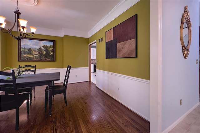 13009 Fontana St, Leawood, KS 66209 - dining space featuring a chandelier, wood finished floors, and ornamental molding