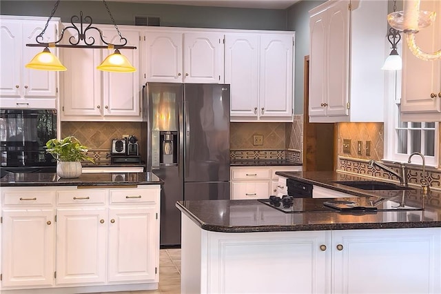 13009 Fontana St, Leawood, KS 66209 - kitchen featuring black appliances, white cabinetry, tasteful backsplash, and dark stone countertops
