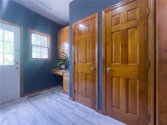 13009 Fontana St, Leawood, KS 66209 - doorway to outside with light wood-type flooring and baseboards