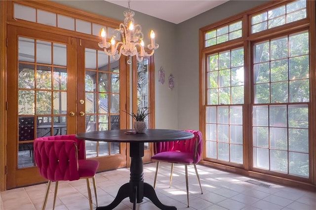 13009 Fontana St, Leawood, KS 66209 - dining space with a chandelier, french doors, and light tile patterned flooring