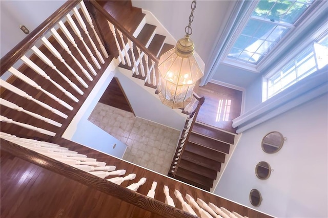 13009 Fontana St, Leawood, KS 66209 - staircase with a high ceiling