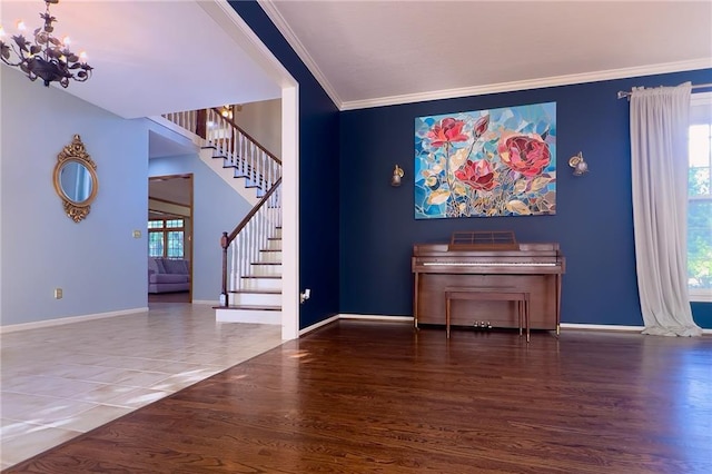 13009 Fontana St, Leawood, KS 66209 - living room with stairs, ornamental molding, a chandelier, and wood finished floors