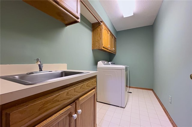 13009 Fontana St, Leawood, KS 66209 - washroom featuring cabinet space, washing machine and clothes dryer, and light tile patterned floors