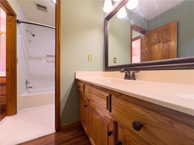 13009 Fontana St, Leawood, KS 66209 - bathroom with vanity, shower / tub combination, and wood finished floors