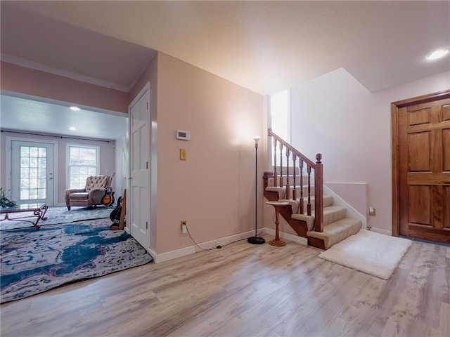13009 Fontana St, Leawood, KS 66209 - entryway with light wood-type flooring, stairs, and recessed lighting