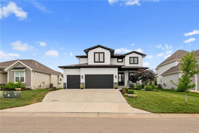 15297 W 172nd Pl, Olathe, KS 66062 - view of front of house with an attached garage, a front yard, driveway, and stone siding