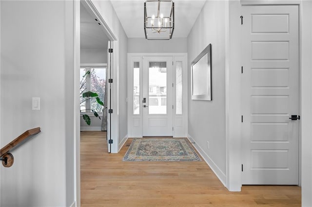 15297 W 172nd Pl, Olathe, KS 66062 - foyer with a chandelier and light wood-type flooring