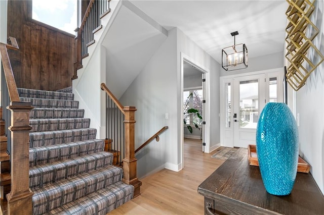 15297 W 172nd Pl, Olathe, KS 66062 - entryway featuring light wood finished floors, a chandelier, and stairs
