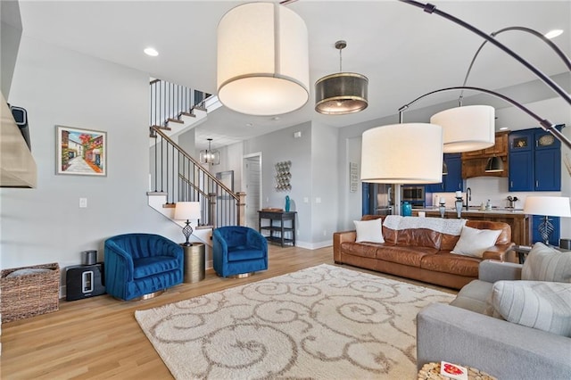 15297 W 172nd Pl, Olathe, KS 66062 - living room featuring stairs, light wood-type flooring, and recessed lighting