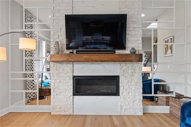 15297 W 172nd Pl, Olathe, KS 66062 - detailed view of a glass covered fireplace and wood finished floors
