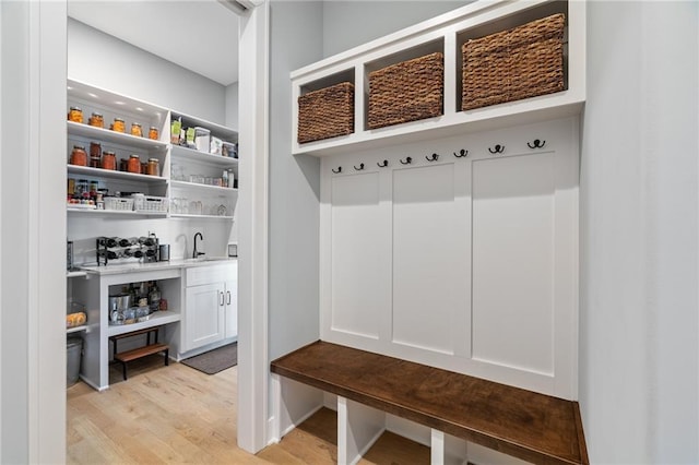 15297 W 172nd Pl, Olathe, KS 66062 - mudroom featuring light wood-style flooring and bar with sink