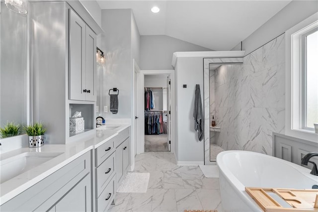 15297 W 172nd Pl, Olathe, KS 66062 - full bath with marble look tile flooring, a marble finish shower, double vanity, a freestanding tub, and healthy amount of natural light