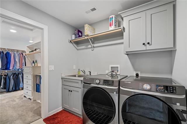 15297 W 172nd Pl, Olathe, KS 66062 - laundry room with washer and clothes dryer, cabinet space, and carpet flooring
