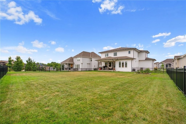 15297 W 172nd Pl, Olathe, KS 66062 - back of house with a fenced backyard and stucco siding