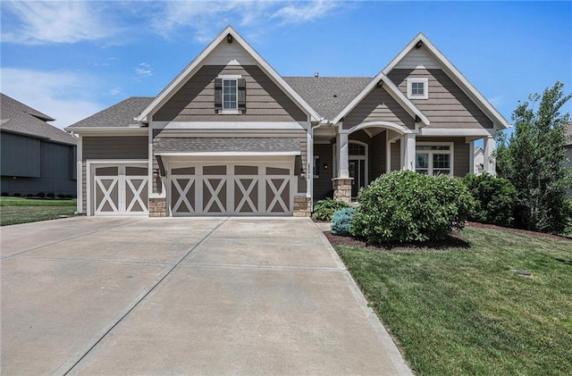 25072 W 114th Ct, Olathe, KS 66061 - craftsman-style house with stone siding, a front yard, and a garage