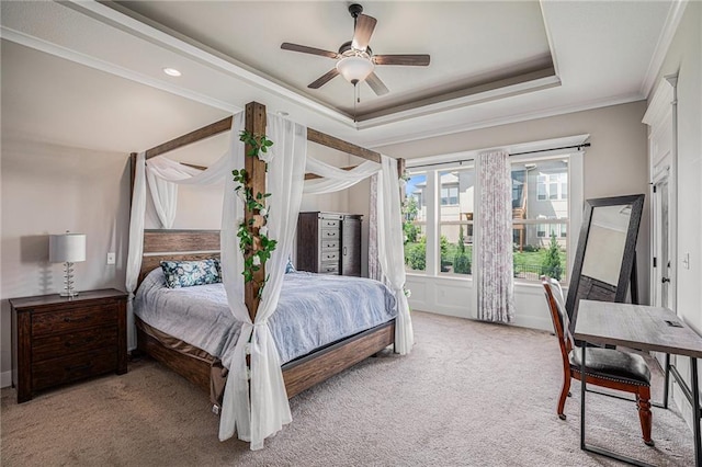 25072 W 114th Ct, Olathe, KS 66061 - bedroom with ornamental molding, a tray ceiling, light carpet, and ceiling fan