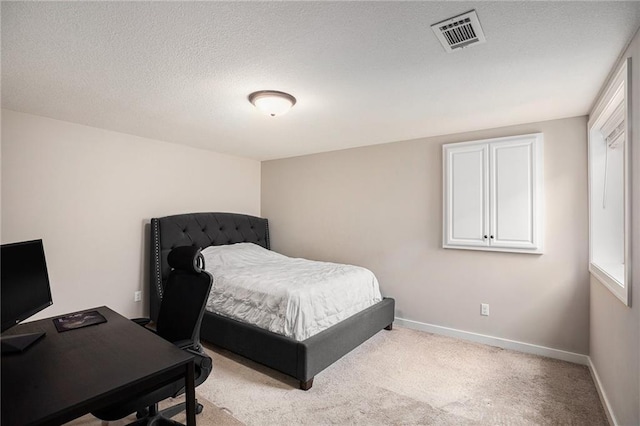 25072 W 114th Ct, Olathe, KS 66061 - bedroom featuring light colored carpet, a textured ceiling, and a desk