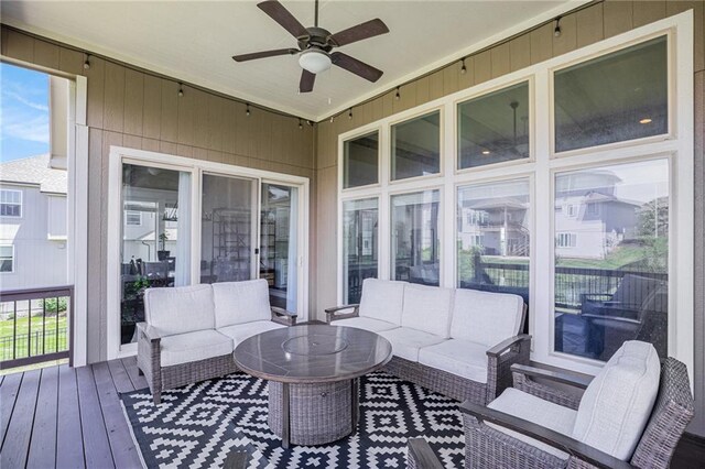25072 W 114th Ct, Olathe, KS 66061 - wooden deck with an outdoor living space and a ceiling fan