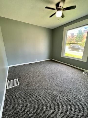 2022 Jules St, Saint Joseph, MO 64501 - empty room with carpet flooring and a ceiling fan