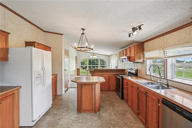 507 NW 165th Rd, Centerview, MO 64019 - kitchen featuring stainless steel appliances, ornamental molding, a textured ceiling, a chandelier, and brown cabinetry