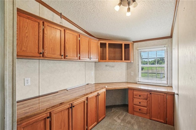 507 NW 165th Rd, Centerview, MO 64019 - unfurnished office featuring a textured ceiling, built in study area, crown molding, and carpet flooring